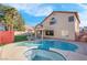 Inviting kidney-shaped pool with a spa and covered patio at 6586 W Mesa Vista Ave, Las Vegas, NV 89118