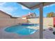 Backyard with a private pool, hot tub, and privacy wall at 6586 W Mesa Vista Ave, Las Vegas, NV 89118