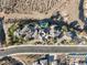 Stunning aerial view of a luxury home with a uniquely shaped pool and desert landscaping at 942 Villa Grande Way, Boulder City, NV 89005