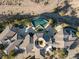 Overhead shot of an estate featuring a modern architectural design and a private, curved swimming pool at 942 Villa Grande Way, Boulder City, NV 89005