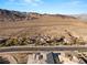 Aerial view of an exclusive neighborhood with mountain views, desert landscaping, and custom homes at 942 Villa Grande Way, Boulder City, NV 89005