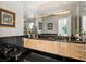 This elegant powder room has marbled floors, a black countertop, and an ornate mirror at 942 Villa Grande Way, Boulder City, NV 89005