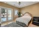 This well-lit bedroom features a plush bed and a walk-out to a personal patio at 942 Villa Grande Way, Boulder City, NV 89005