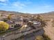 View of a custom home on a tiered lot with stone accents, lush landscaping, and a private pool at 942 Villa Grande Way, Boulder City, NV 89005