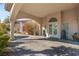 Stunning stucco home featuring a grand entrance with stone lions and decorative glass double doors at 942 Villa Grande Way, Boulder City, NV 89005