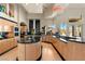 Modern kitchen featuring custom cabinetry, a center island with bar seating, and mountain views at 942 Villa Grande Way, Boulder City, NV 89005