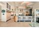 Spacious kitchen featuring custom cabinets, a center island with bar seating, and high-end finishes at 942 Villa Grande Way, Boulder City, NV 89005