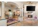 This open floor plan highlights a cozy fireplace, built-in cabinetry and a wet bar area at 942 Villa Grande Way, Boulder City, NV 89005