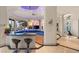 Bright living area featuring bar seating, elegant columns, and views of the home's interior and exterior at 942 Villa Grande Way, Boulder City, NV 89005