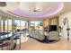 Bright open living room showcasing a fireplace, bar seating, and sliding doors with mountain views at 942 Villa Grande Way, Boulder City, NV 89005