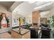 Open living room area with a mirrored wall, a marble fireplace, and great lighting at 942 Villa Grande Way, Boulder City, NV 89005