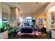 Spacious living room with a marble fireplace, plush seating, and mirrored walls at 942 Villa Grande Way, Boulder City, NV 89005