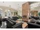 Cozy living room featuring a marble fireplace, black tile floors, and large seating areas at 942 Villa Grande Way, Boulder City, NV 89005