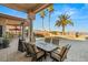 Inviting outdoor dining area with scenic views, covered patio, and elegant furniture at 942 Villa Grande Way, Boulder City, NV 89005