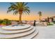 Luxurious spa with a cascading waterfall, mature palm trees, and picturesque scenery at 942 Villa Grande Way, Boulder City, NV 89005