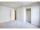 Bedroom with carpet, door, and mirrored closet at 5060 Indian River Dr # 377, Las Vegas, NV 89103
