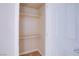 Shelved closet with a white door at 5060 Indian River Dr # 377, Las Vegas, NV 89103
