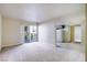 Living room with carpeting, access to balcony and kitchen at 5060 Indian River Dr # 377, Las Vegas, NV 89103