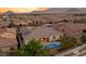 Aerial view of home with pool and mountain views at 10086 Mountain Foothills Ave, Las Vegas, NV 89149