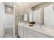 Double vanity bathroom with white cabinets and a bathtub at 10086 Mountain Foothills Ave, Las Vegas, NV 89149