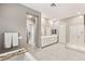 Luxurious bathroom with double vanities, a large shower, and a soaking tub at 10086 Mountain Foothills Ave, Las Vegas, NV 89149