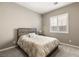 Charming bedroom with a queen-sized bed and ample natural light at 10086 Mountain Foothills Ave, Las Vegas, NV 89149