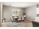 Bright dining room with a rustic wooden table and neutral decor at 10086 Mountain Foothills Ave, Las Vegas, NV 89149