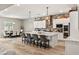 Spacious kitchen with white cabinets, large island, and stylish backsplash at 10086 Mountain Foothills Ave, Las Vegas, NV 89149