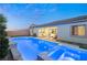 Inviting pool and spa area with outdoor patio furniture at 10086 Mountain Foothills Ave, Las Vegas, NV 89149