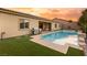 Luxury pool and spa with artificial turf and grill at 10086 Mountain Foothills Ave, Las Vegas, NV 89149