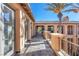 Long balcony with tile floors and views of the surrounding landscape at 10117 Summit Canyon Dr, Las Vegas, NV 89144