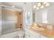 Cozy bathroom with a shower-tub combo and a vanity with designer finishes at 10117 Summit Canyon Dr, Las Vegas, NV 89144