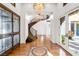 Elegant foyer featuring a grand staircase and chandelier at 10117 Summit Canyon Dr, Las Vegas, NV 89144