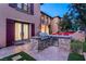 Outdoor kitchen with stainless steel grill, countertop, and easy access to outdoor seating at 10117 Summit Canyon Dr, Las Vegas, NV 89144