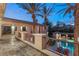 Upper level view of backyard pool with lounge chairs and poolside covered patio at 10117 Summit Canyon Dr, Las Vegas, NV 89144