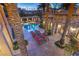 Aerial view of backyard pool, lounge chairs, covered patio and stunning stone house at 10117 Summit Canyon Dr, Las Vegas, NV 89144