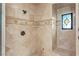 Shower with tile surround and built-in shelves at 10117 Summit Canyon Dr, Las Vegas, NV 89144