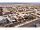 Picturesque neighborhood aerial view showcases a two-story home with solar panels and desert landscaping at 1012 Water Cove St, Henderson, NV 89011