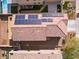 Birds eye view of solar panels on roof, backyard landscaping, pool, and fire pit at 1012 Water Cove St, Henderson, NV 89011