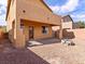 Backyard featuring a covered patio and low-maintenance desert landscaping at 1012 Water Cove St, Henderson, NV 89011