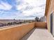 Open balcony with stucco wall offers neighborhood views and a serene outdoor living space at 1012 Water Cove St, Henderson, NV 89011