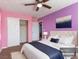 Cozy bedroom featuring a ceiling fan, closet, and plush bedding in a stylishly decorated space at 1012 Water Cove St, Henderson, NV 89011