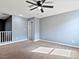 Bright bedroom with carpeted floors, ceiling fan and neutral walls ready for personalization and relaxation at 1012 Water Cove St, Henderson, NV 89011