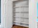 Interior of a reach-in closet featuring multiple shelves and a white door at 1012 Water Cove St, Henderson, NV 89011