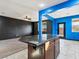 Kitchen island featuring granite countertops and a view into the open concept living room at 1012 Water Cove St, Henderson, NV 89011