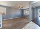 Empty living room featuring gray walls, carpet floors, and a well-lit open space at 1012 Water Cove St, Henderson, NV 89011