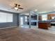 Open-concept living space with a view of the kitchen featuring tile floors and stainless steel appliances at 1012 Water Cove St, Henderson, NV 89011