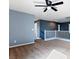 Open loft space with carpet, a ceiling fan and a white railing, creating a bright, transitional space at 1012 Water Cove St, Henderson, NV 89011