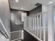 Bright upstairs hallway with white railing and gray walls offering a modern and clean aesthetic at 1012 Water Cove St, Henderson, NV 89011