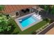 Aerial view of a rectangular pool with tanning ledge and patio at 10201 Los Padres Pl, Las Vegas, NV 89134